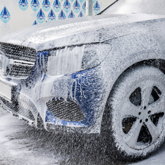 Washing car with snow foam.
