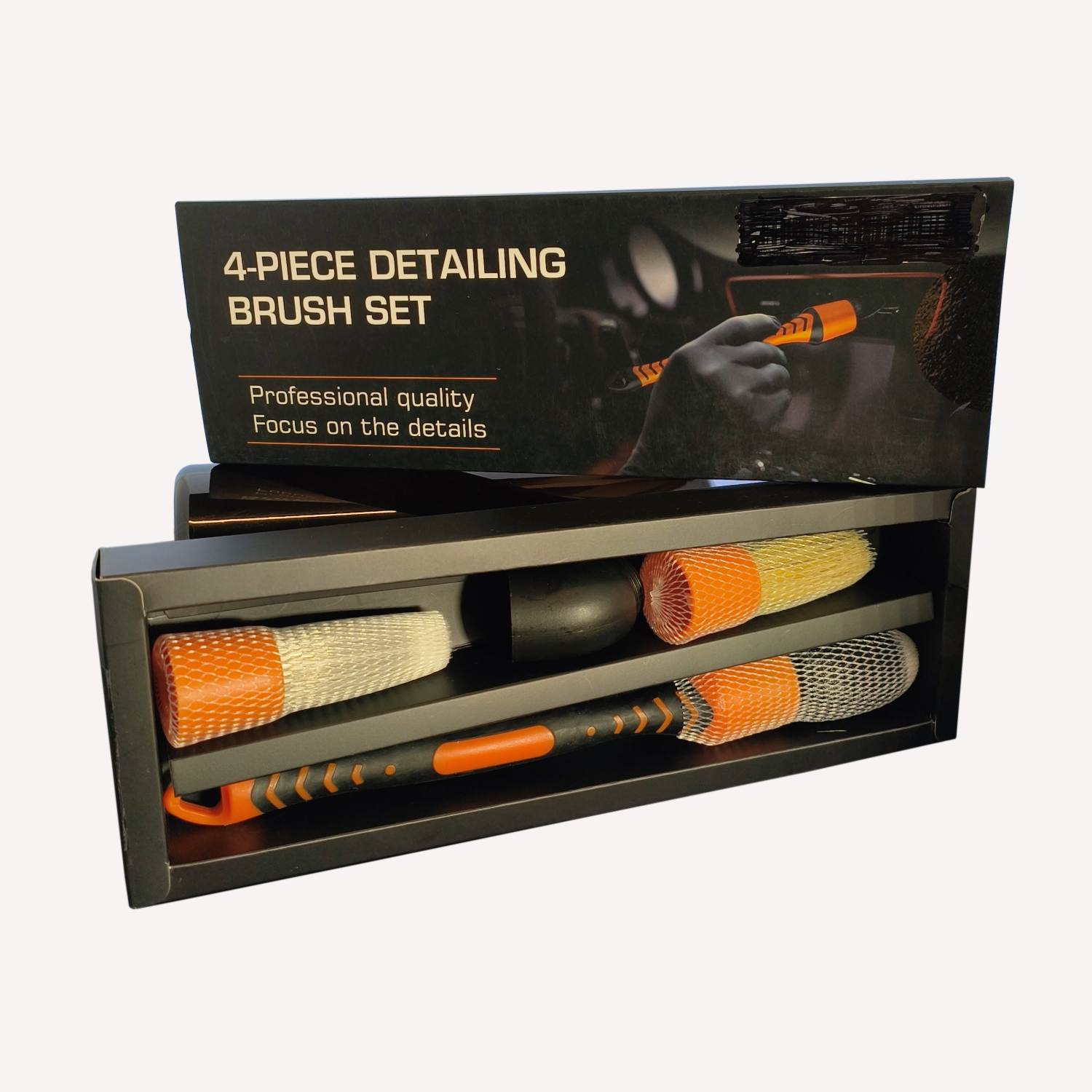 Detailing brush set in black packaging with orange features.