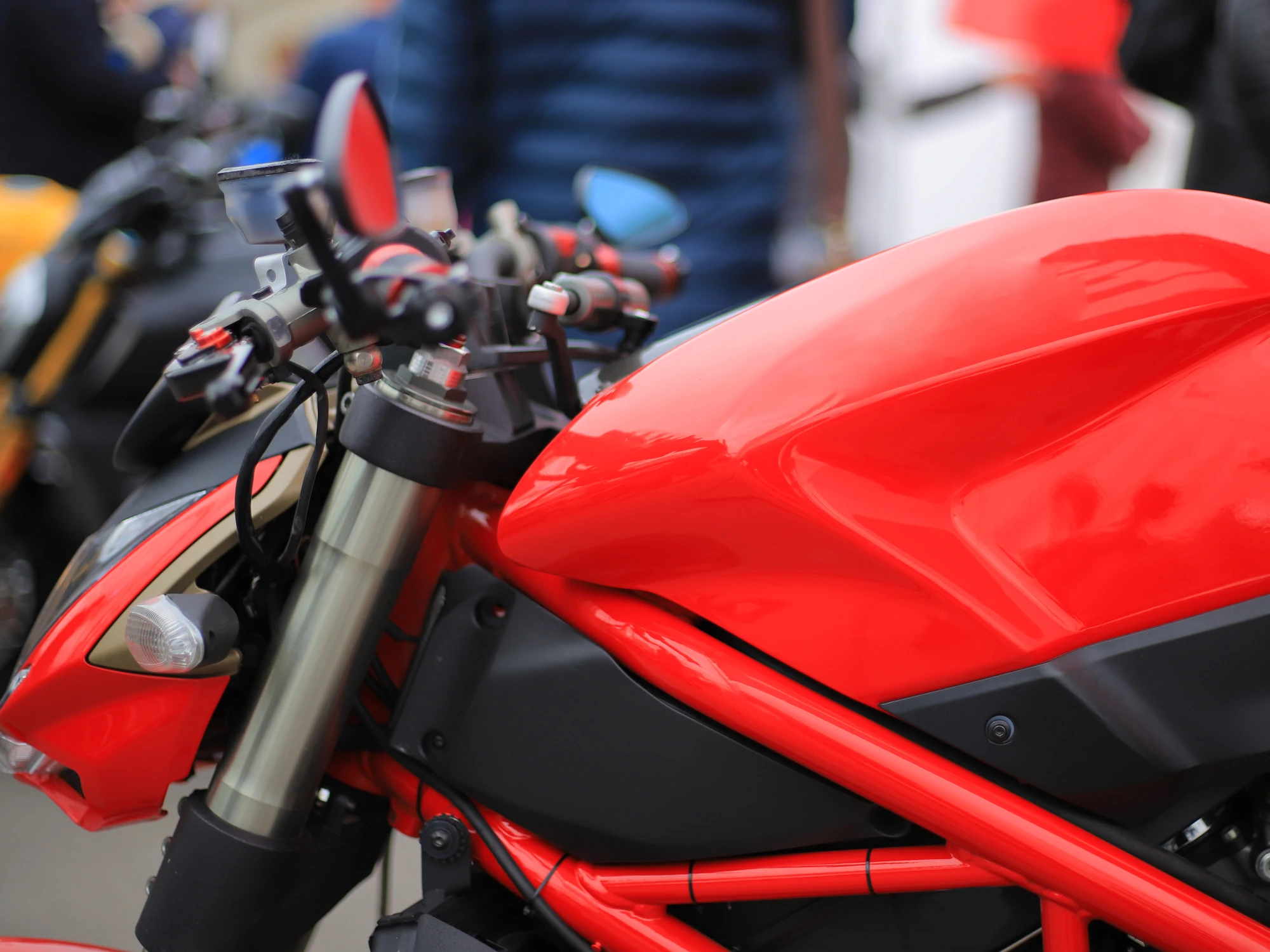 Close up of shiny red motorbike.