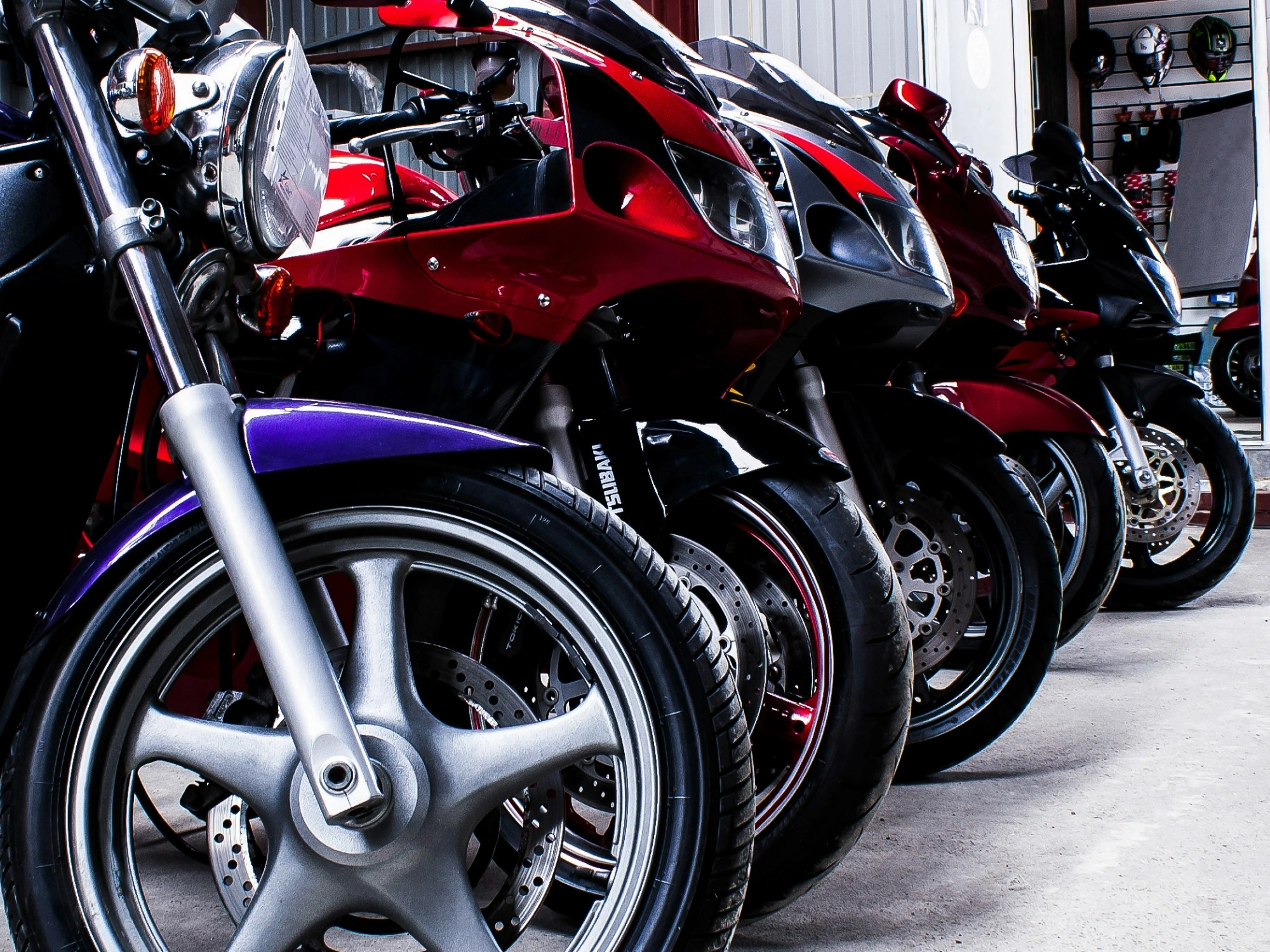 Five motorbikes lined up in a row.
